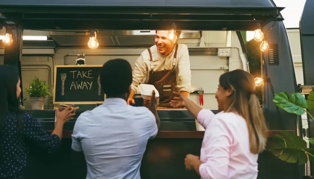 A man stand inside food truck