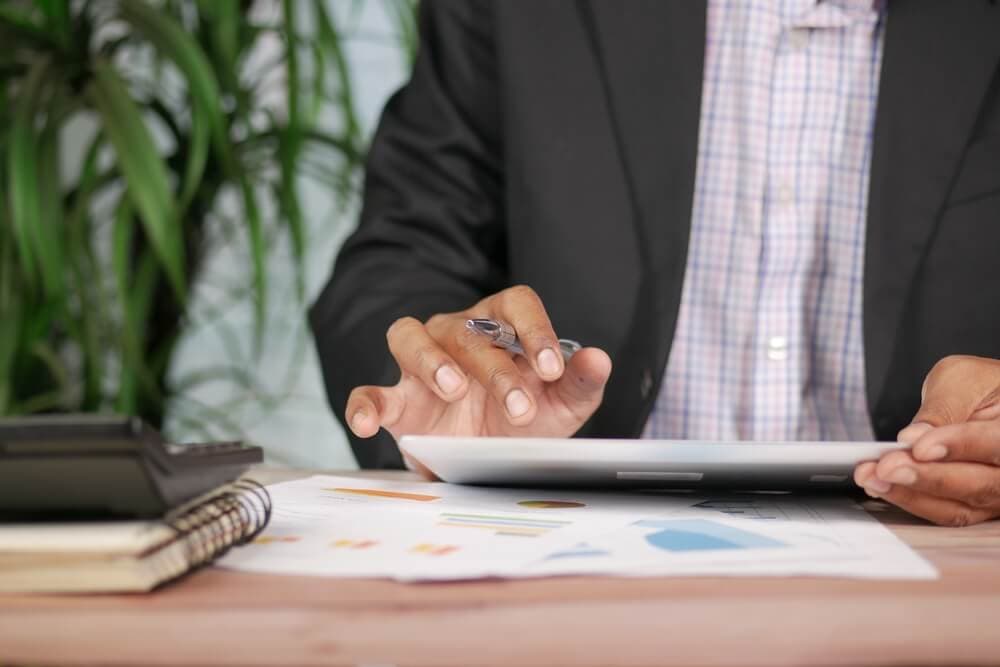 image of a man reading a merchant statement.